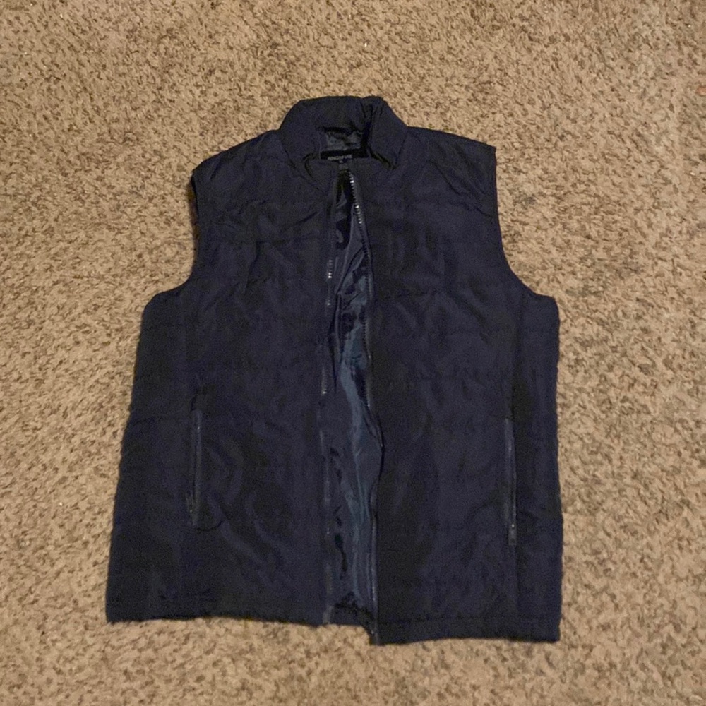 Blue puffer vest.